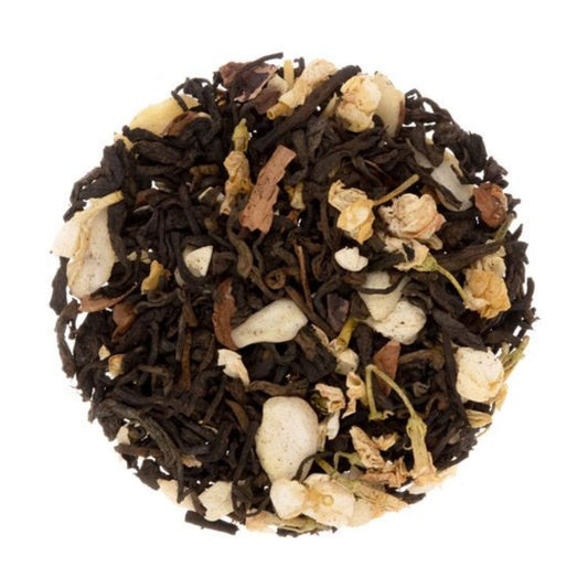 Tea ball with black and white tea leaves on a white background