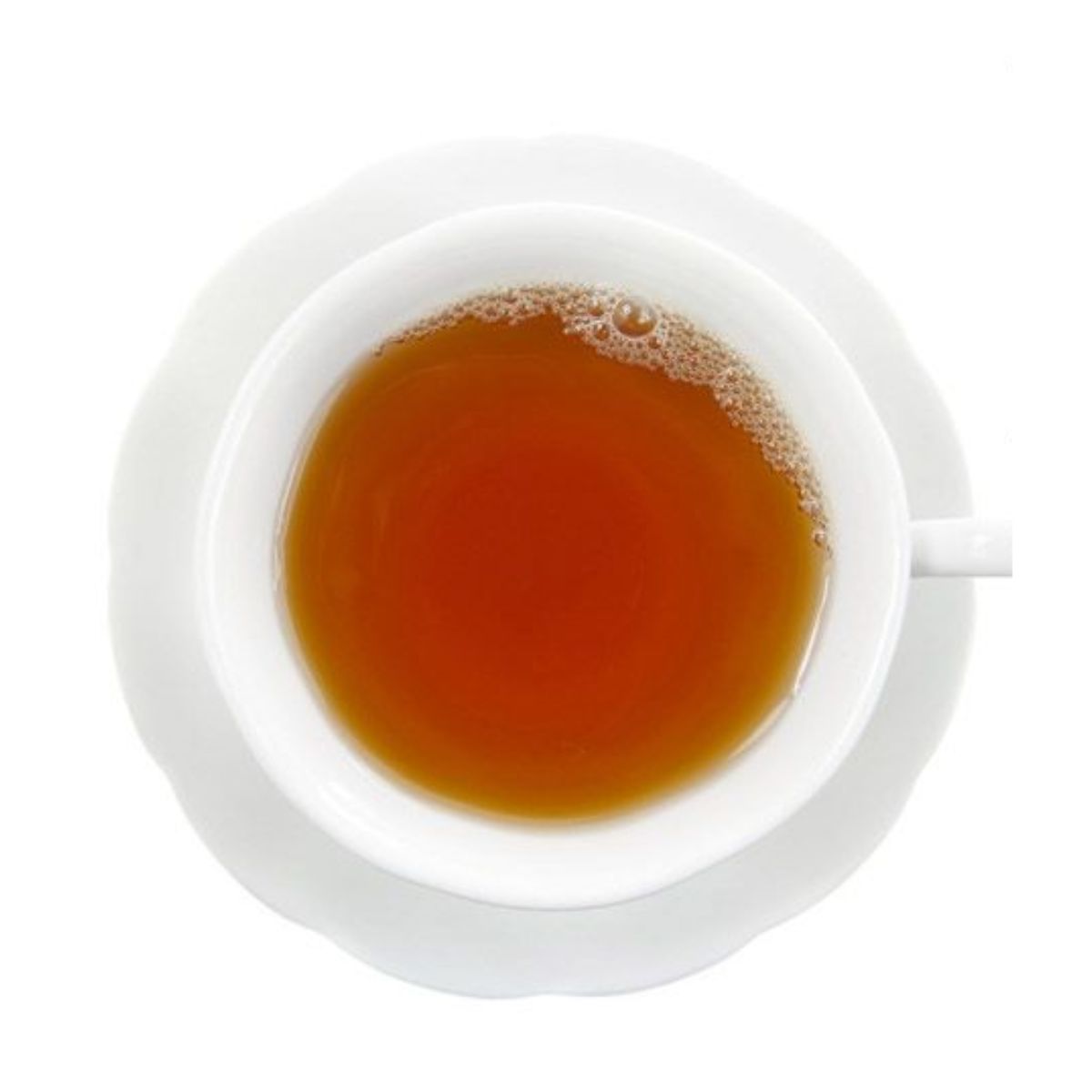 Hot light amber tea in a white teacup on a white saucer and on a white background