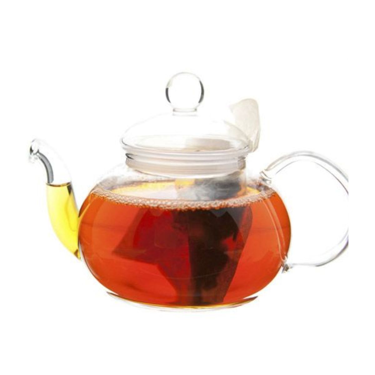 Glass teapot with amber tea and a teabag inside.