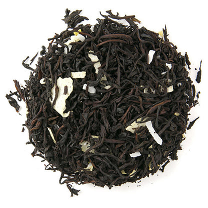 Loose leaf black tea with pieces of naturally flavored coconut, displayed on a white background.