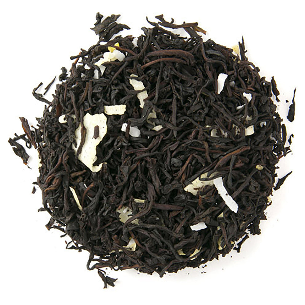 Close-up of black tea leaves with dried coconut pieces intermixed on a white background