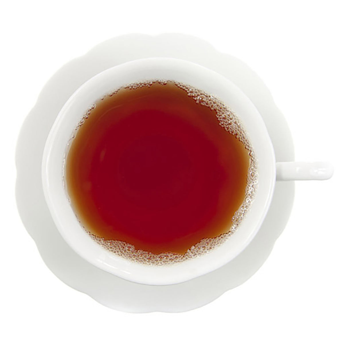 White cup filled with dark red hot tea on a white background