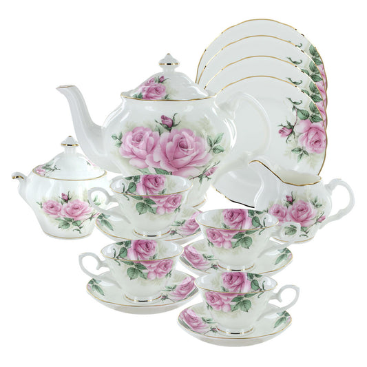 Tea set with pink rose design on a white background