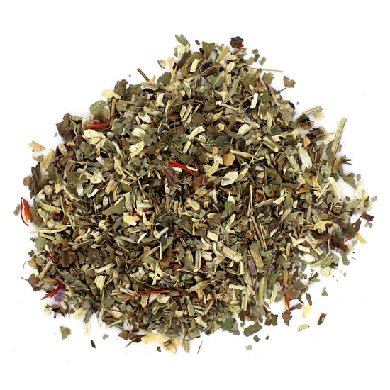 A pile of dried loose leaf tea with visible pieces of cranberry and herbs.
