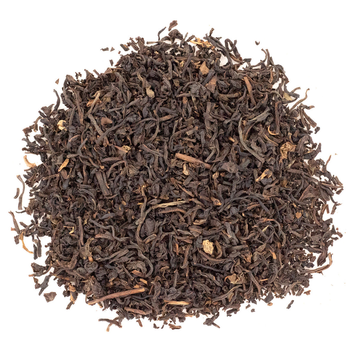 Dry black tea leaves on a white background