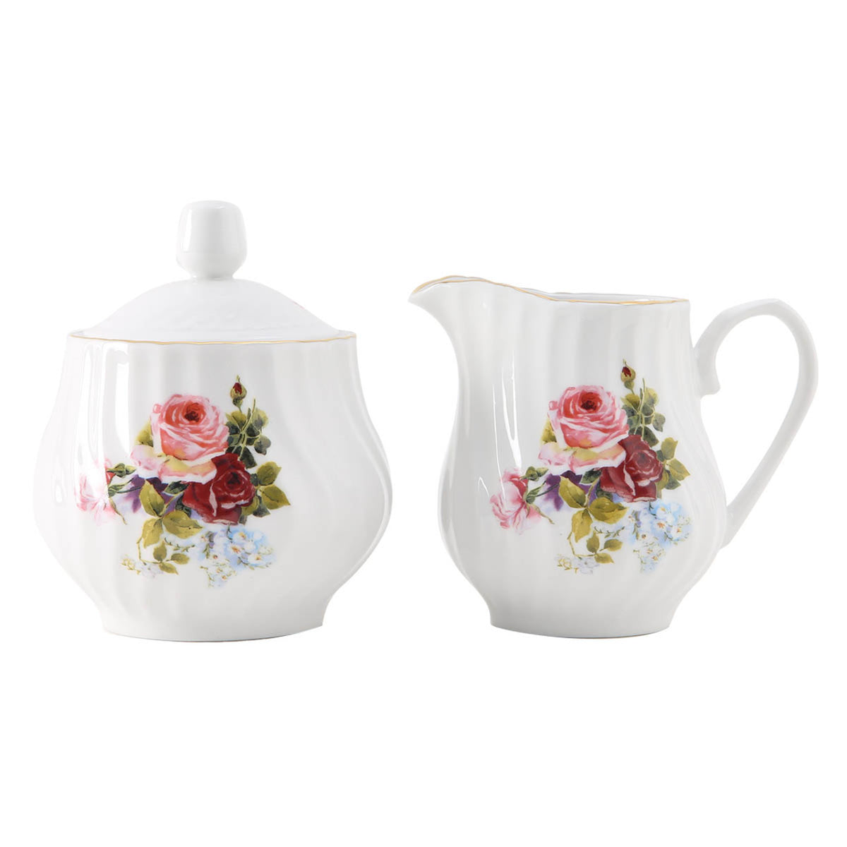 White porcelain sugar bowl and creamer set with floral designs on a white background