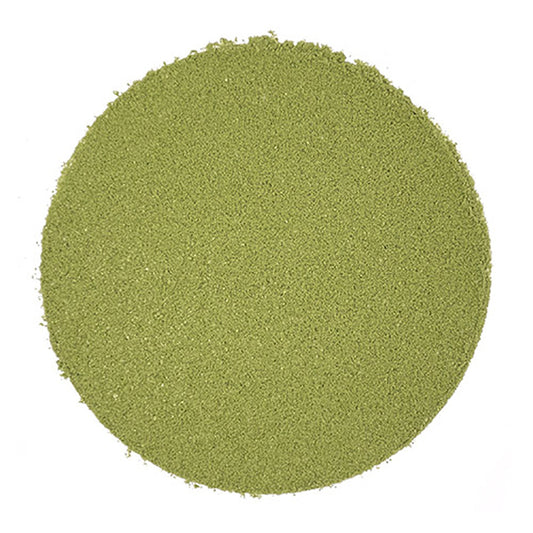 Round green matcha powder on a white background