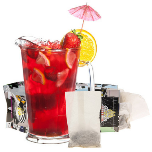 Red iced tea with strawberries and lemon slices, accompanied by teabags on a white background.