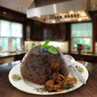 Traditional Christmas pudding on a plate super imposed on a kitchen background