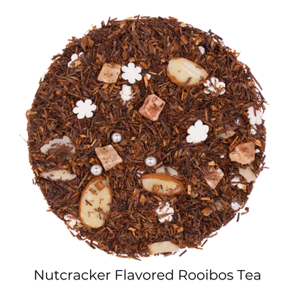 Dried rooibos tea with nut pieces and white candy pieces with product name text on bottom of image for Nutcracker Flavored Rooibos Tea