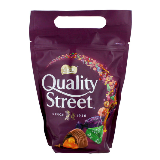Purple Quality Street packaging with colorful candy illustrations on a white background