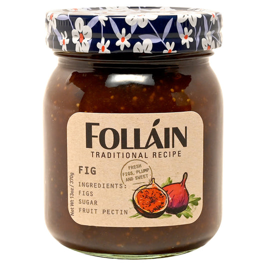 Jar of Folláin fig jam with decorative lid on a white background