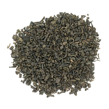 A pile of dry, rolled Gunpowder Green Tea leaves.