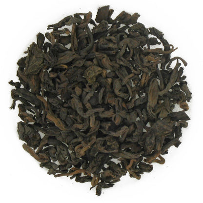 A pile of dry, loose leaf Pu-erh tea.