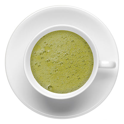 Top-down view of hot matcha green tea in a white cup on a white saucer