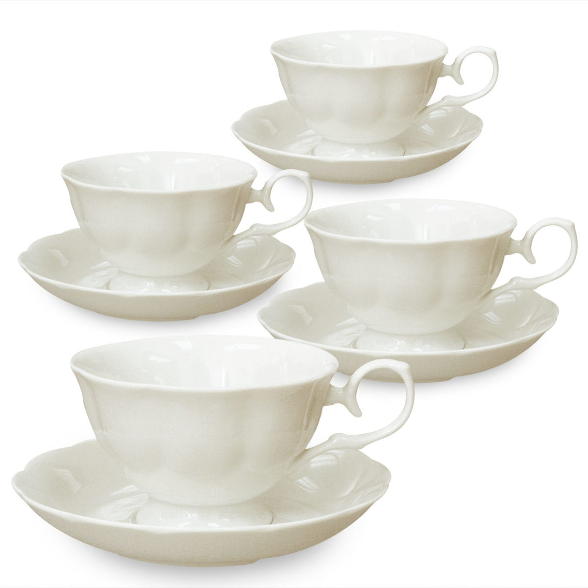 Set of white ceramic teacups and saucers on a white background
