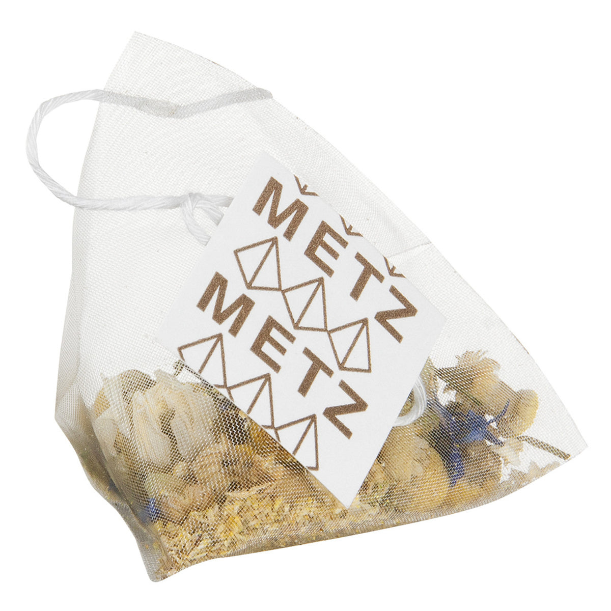 Pyramid style teabag with camomile tea and a Metz label.