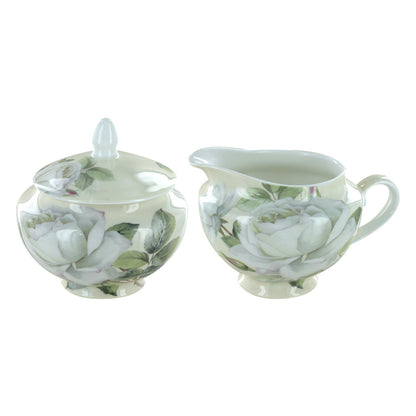 Set of iceberg bone china ceramic sugar bowl and creamer with floral design on a white background