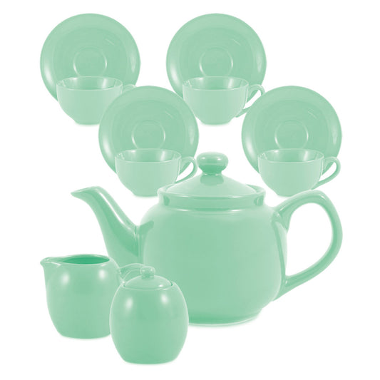 Sea foam green ceramic tea set including teapot, cups, and plates on a white background