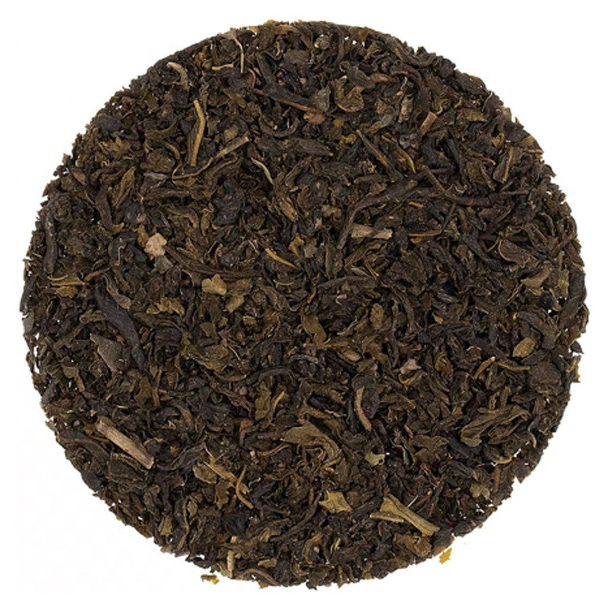 Close-up of dark brown tea leaves on a white background