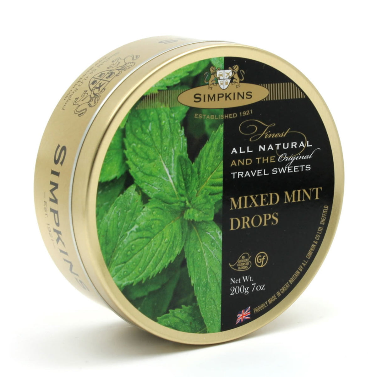 Simpkins mixed mint drops tin with green leaves on a white background