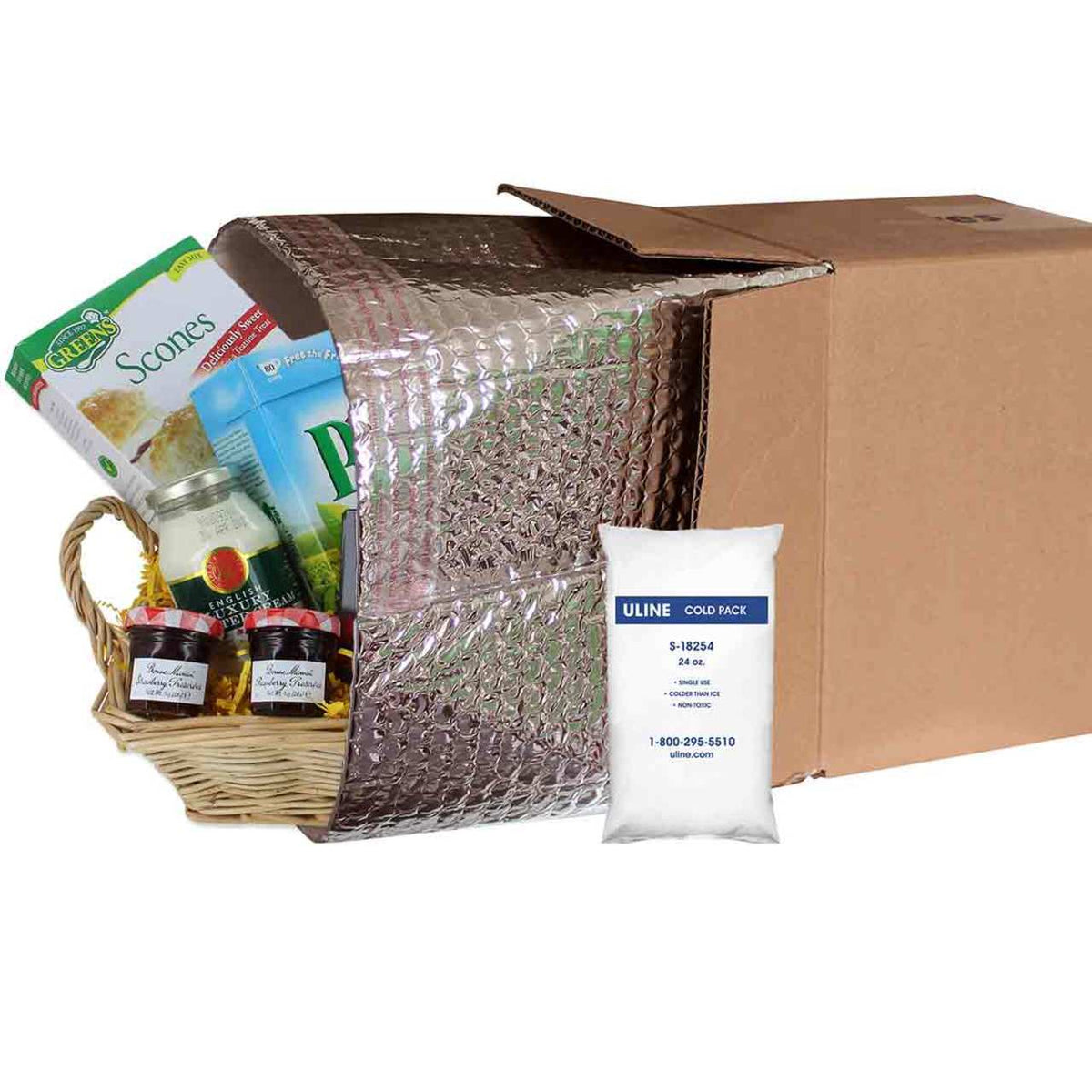 Cardboard box with insulation wrap, a Uline cold pack, and a gift basket on a white background