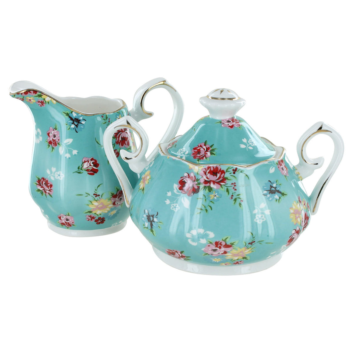 Turquoise porcelain sugar and creamer set with floral design all on a white background.