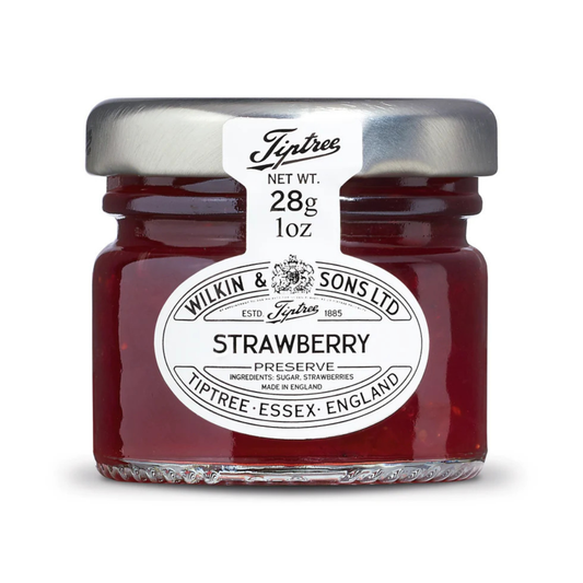Jar of Tiptree Strawberry Preserve with a white label on a white background
