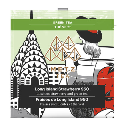 An individually wrapped Metz Long Island Strawberry 950 green tea.  The bag contains a drawing of a young woman in a hat looking at the top of the Empire State Building.