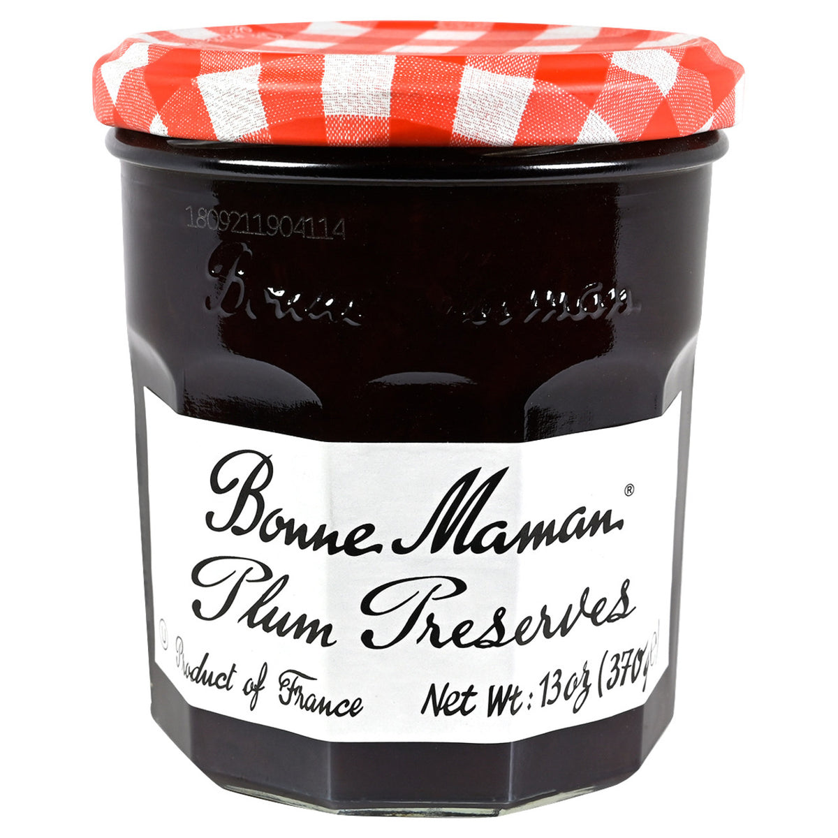 Jar of Bonne Maman Plum Preserves with a red and white checkered lid on a white background