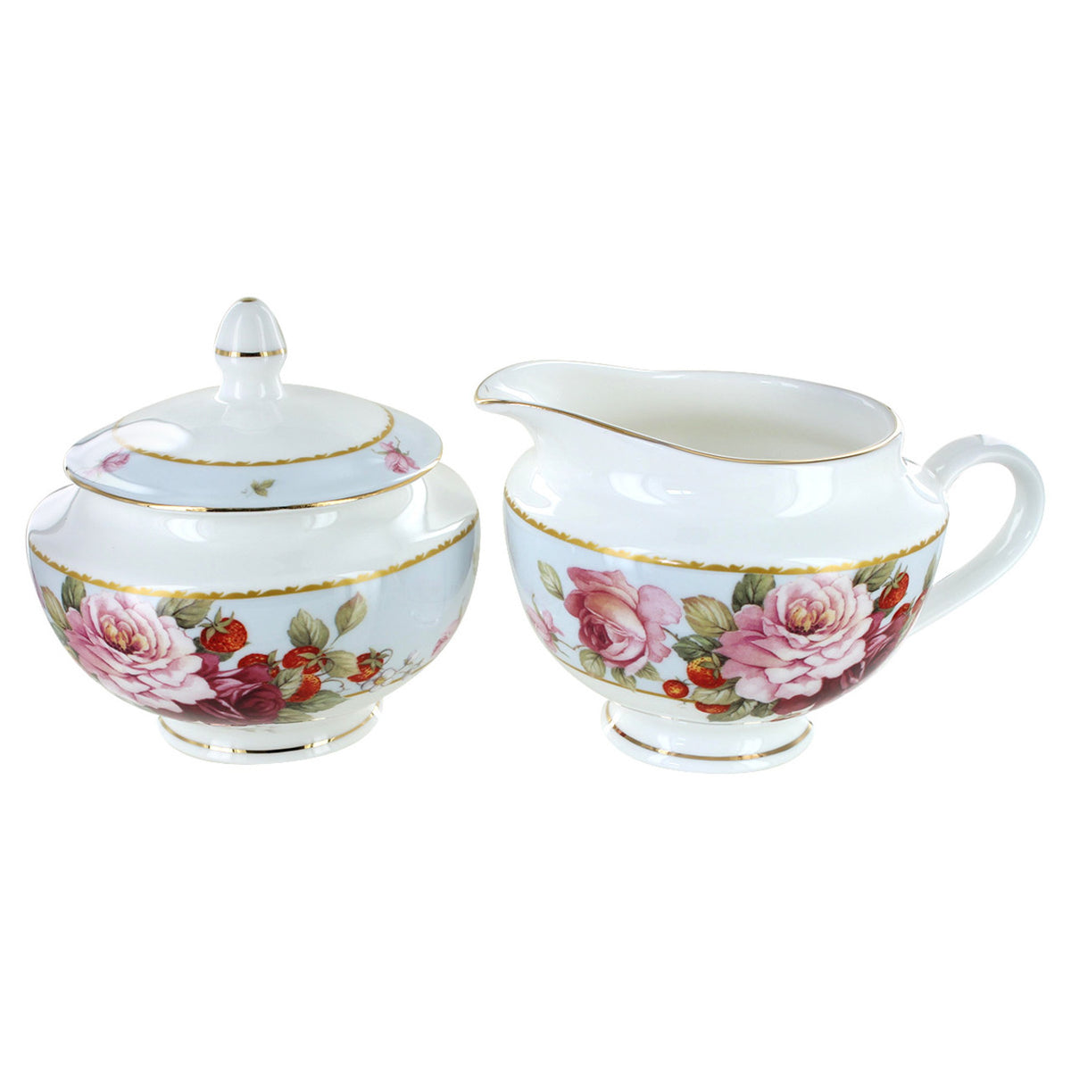Sugar bowl and creamer from a tea set with floral design on a white background