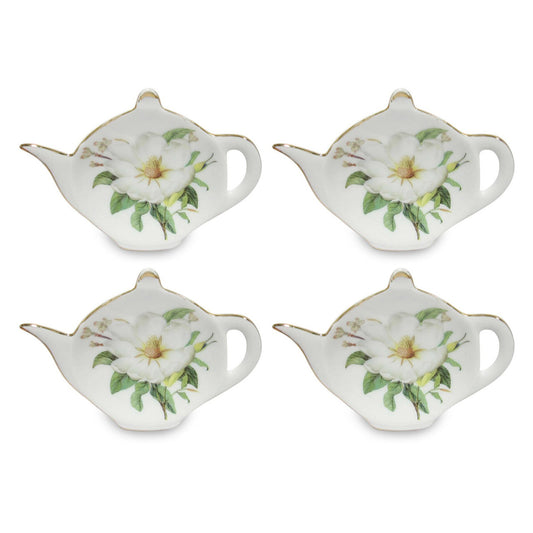 Four small teapot-shaped teabag holder plates with floral design on a white background