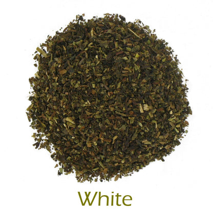 Dry green tea leaves on a white background with 'White' text