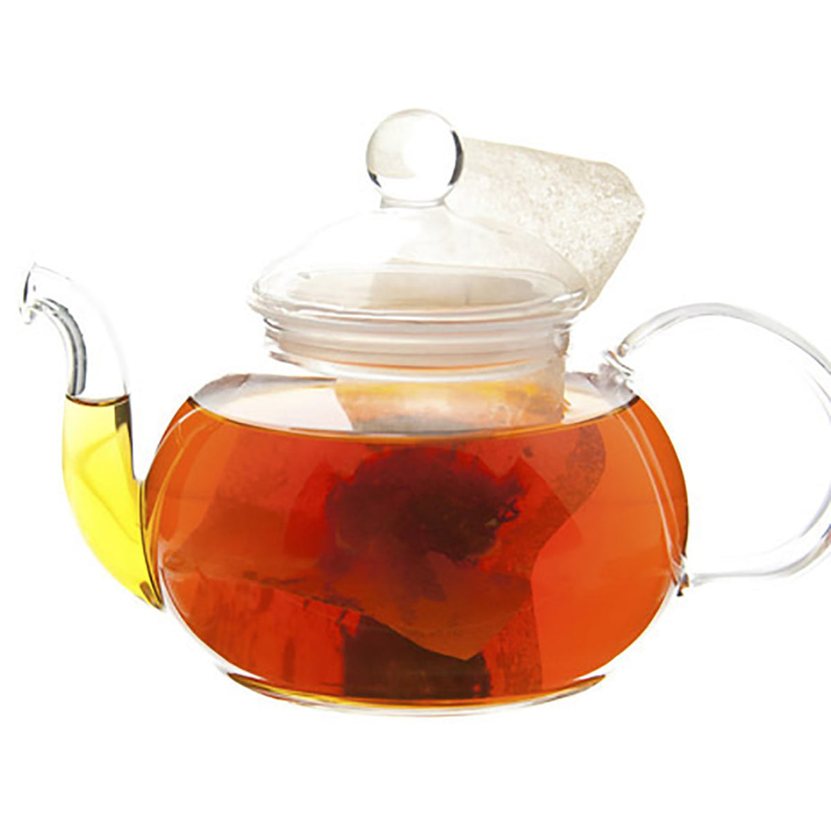Clear glass teapot with a lid filled with red amber colored tea on a white background