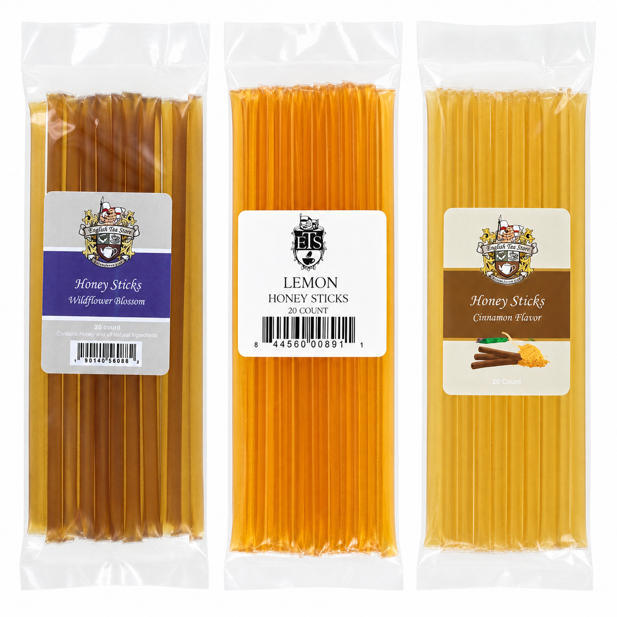 Three packages of honey sticks with different flavors including Wildflower Blossom, Lemon, and Cinnamon Flavor all on a white background
