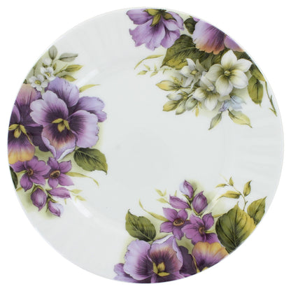 Decorative plate with purple and white floral design on a white background