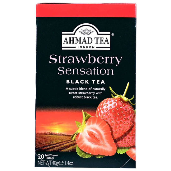 Box of Ahmad Tea Strawberry Sensation Black Tea with black background and strip on the top and images of strawberries.