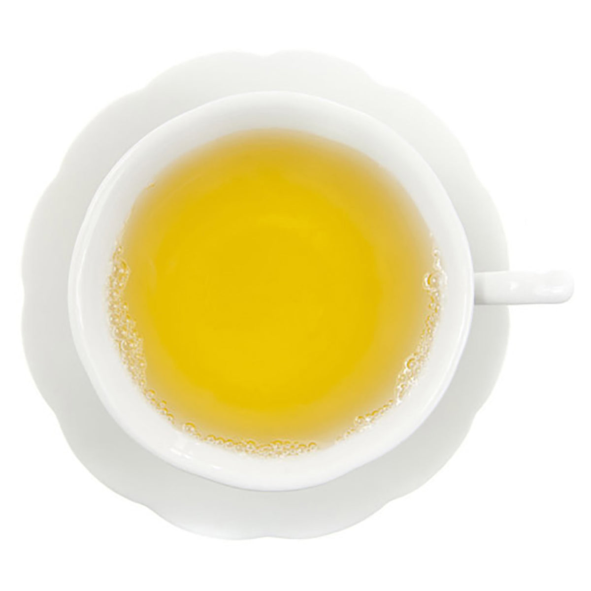 White cup and saucer with yellow hot tea on a white background