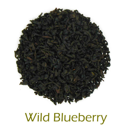 Wild Blueberry loose-leaf tea on a white background with product title text callout at bottom