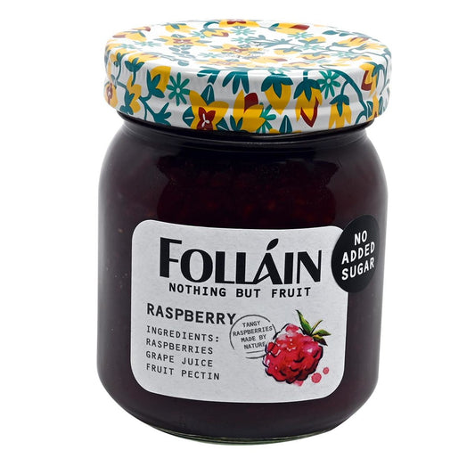 Jar of Folláin raspberry jam with a floral lid on a white background