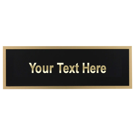 Personalized nameplate with gold text on a black background