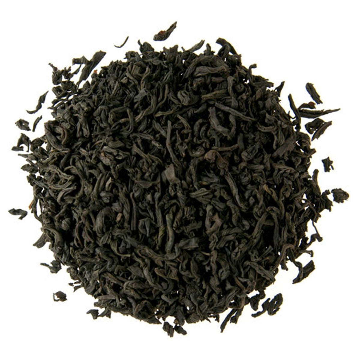 Close-up of black tea leaves on a white background