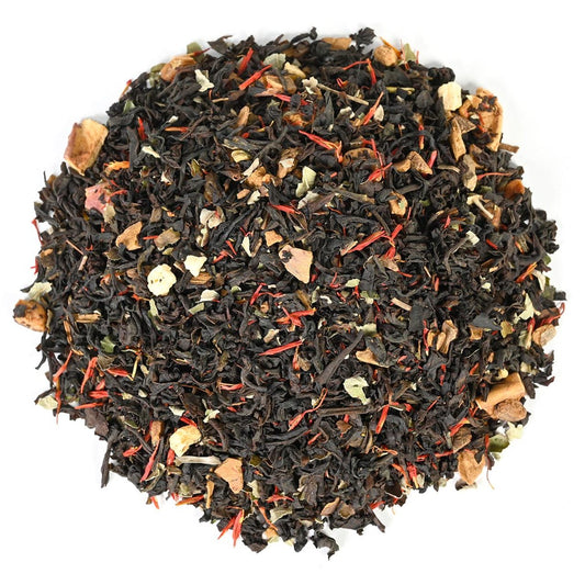  Loose-leaf black tea blend mixed with thin, vibrant red safflower threads, small pieces of dried apple, and cinnamon bark chips