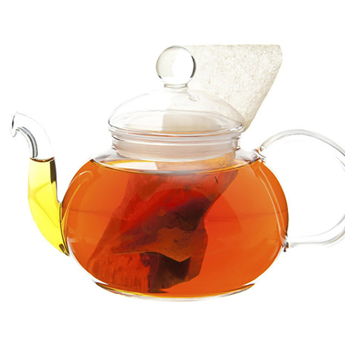 Clear glass teapot with a lid and handle, filled with tea leaves and dark amber liquid tea on a white background
