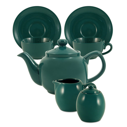 Teal ceramic tea set including teapot, cups, and plates on a white background