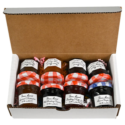 A box of 8 1oz jars of Bonne Maman preserves of various flavors.