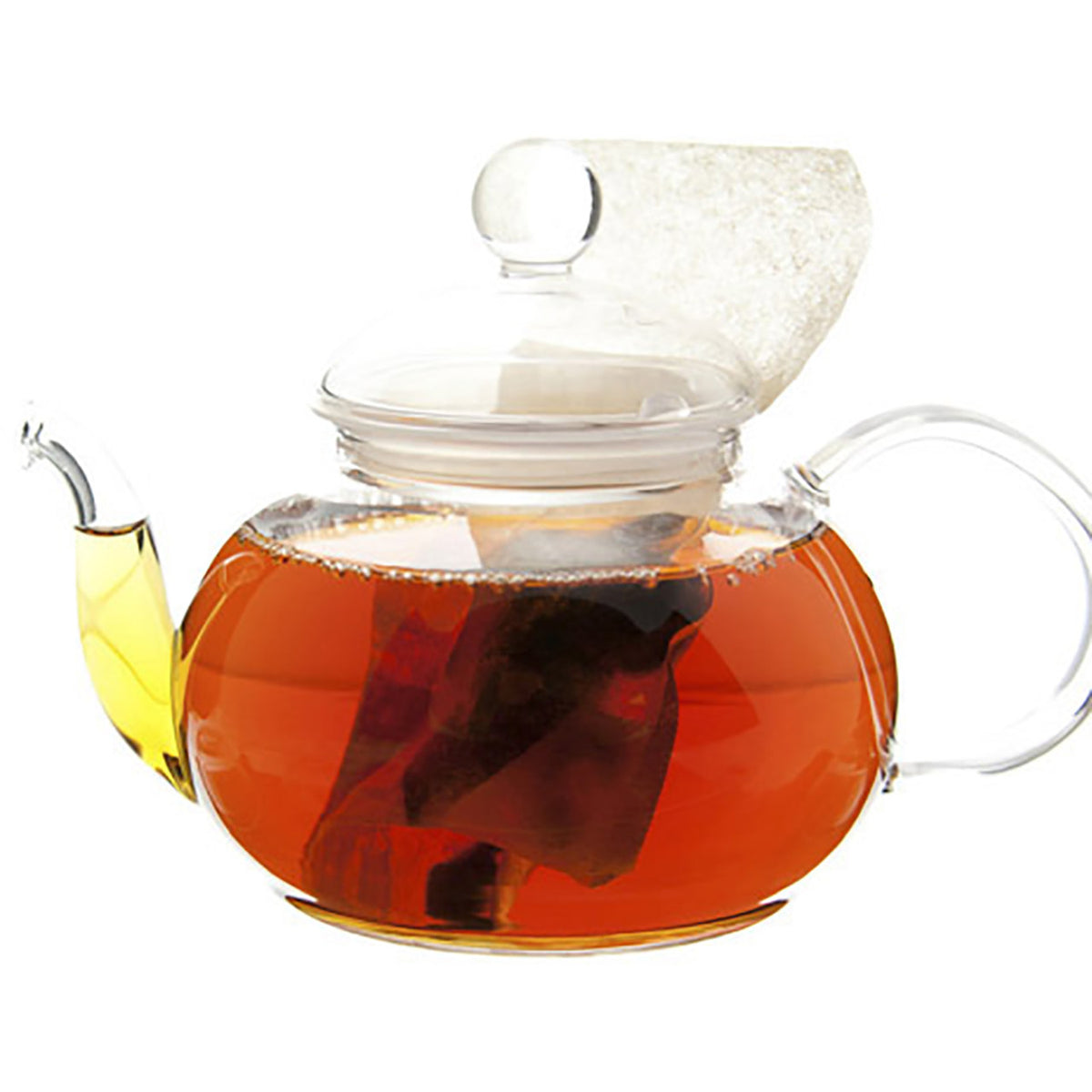 Clear glass teapot with a lid filled with tea on a white background