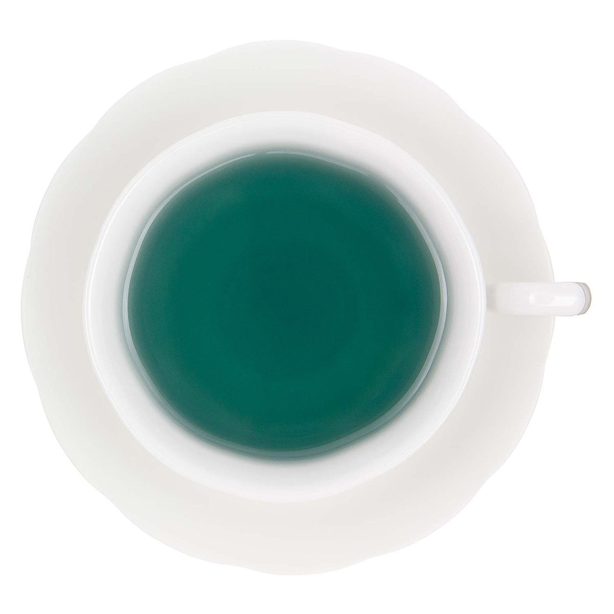 A view of blue tinted hot tea in a white mug and saucer on a white background.