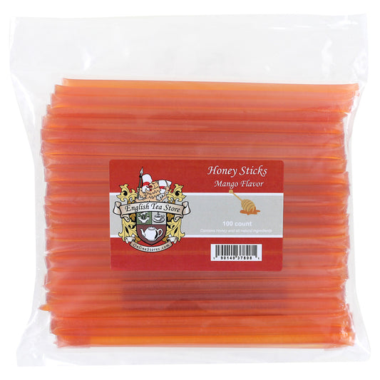 Pack of mango flavored pink hued honey sticks on a white background