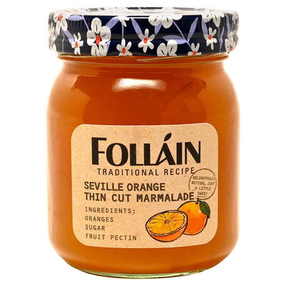 Jar of Folláin Seville Orange Thin Cut Marmalade with decorative lid on a white background